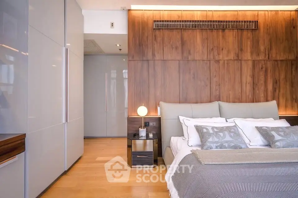 Luxurious modern bedroom with elegant wood paneling and stylish decor