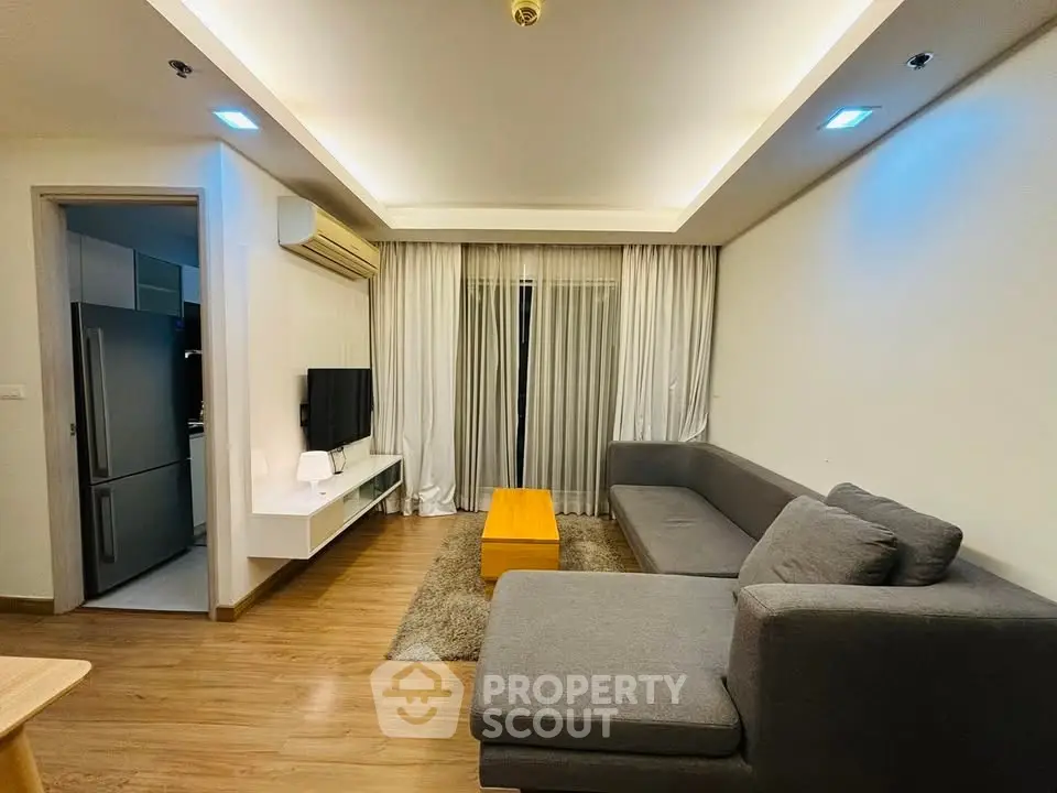 Modern living room with sleek furniture and ambient lighting