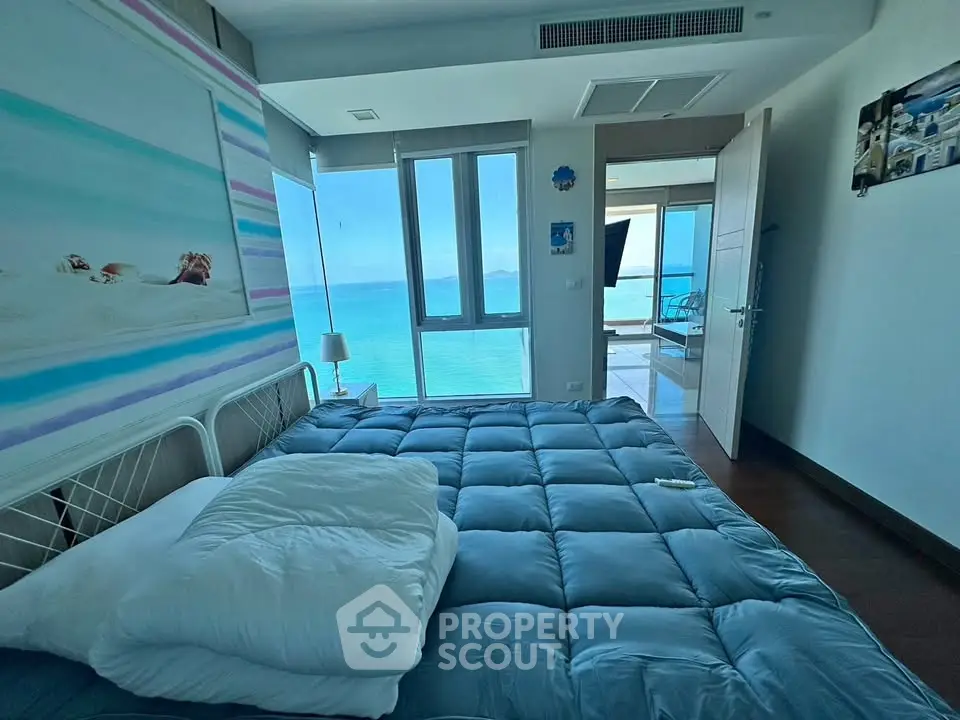 Luxurious bedroom with stunning ocean view and modern decor