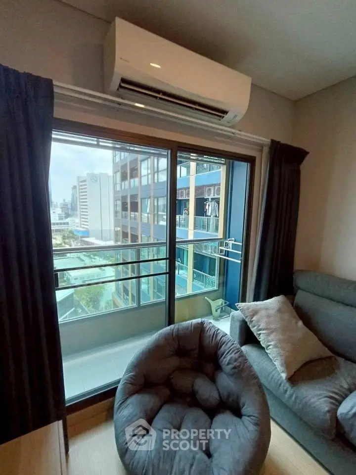 Modern living room with balcony view in urban apartment