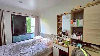 Cozy bedroom with natural light and organized storage space