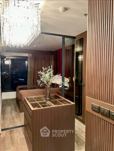 Luxurious bedroom with elegant wood paneling and chandelier lighting