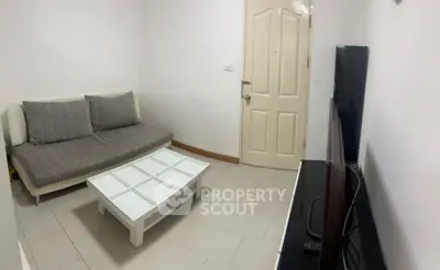 Cozy living room with modern sofa and sleek TV setup