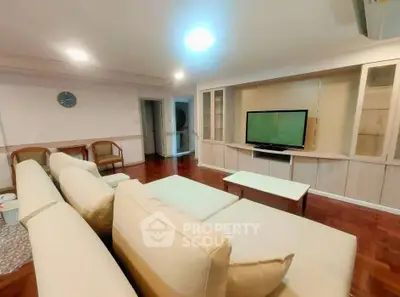 Spacious living room with modern furniture and built-in TV unit