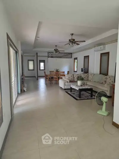 Spacious living room with elegant dining area and modern decor
