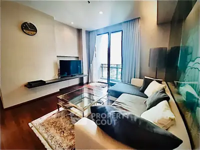 Modern living room with stylish decor and large window balcony view