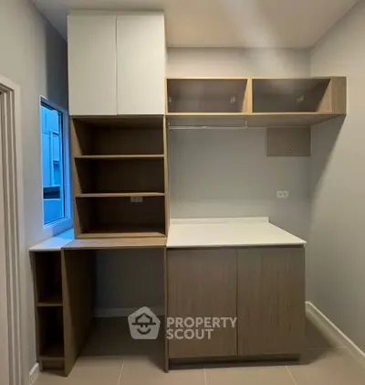 Modern storage room with sleek cabinetry and natural light
