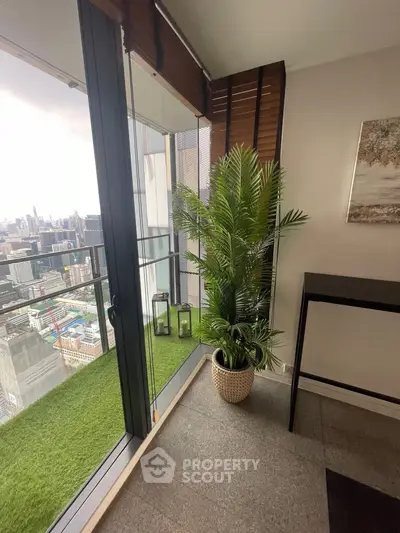 Stylish balcony with artificial grass and city view, perfect for urban living.