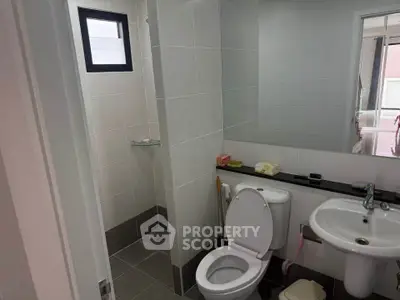 Modern bathroom with sleek fixtures and a walk-in shower, perfect for contemporary living.