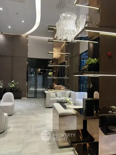 Luxurious modern living room with elegant chandelier and plush seating