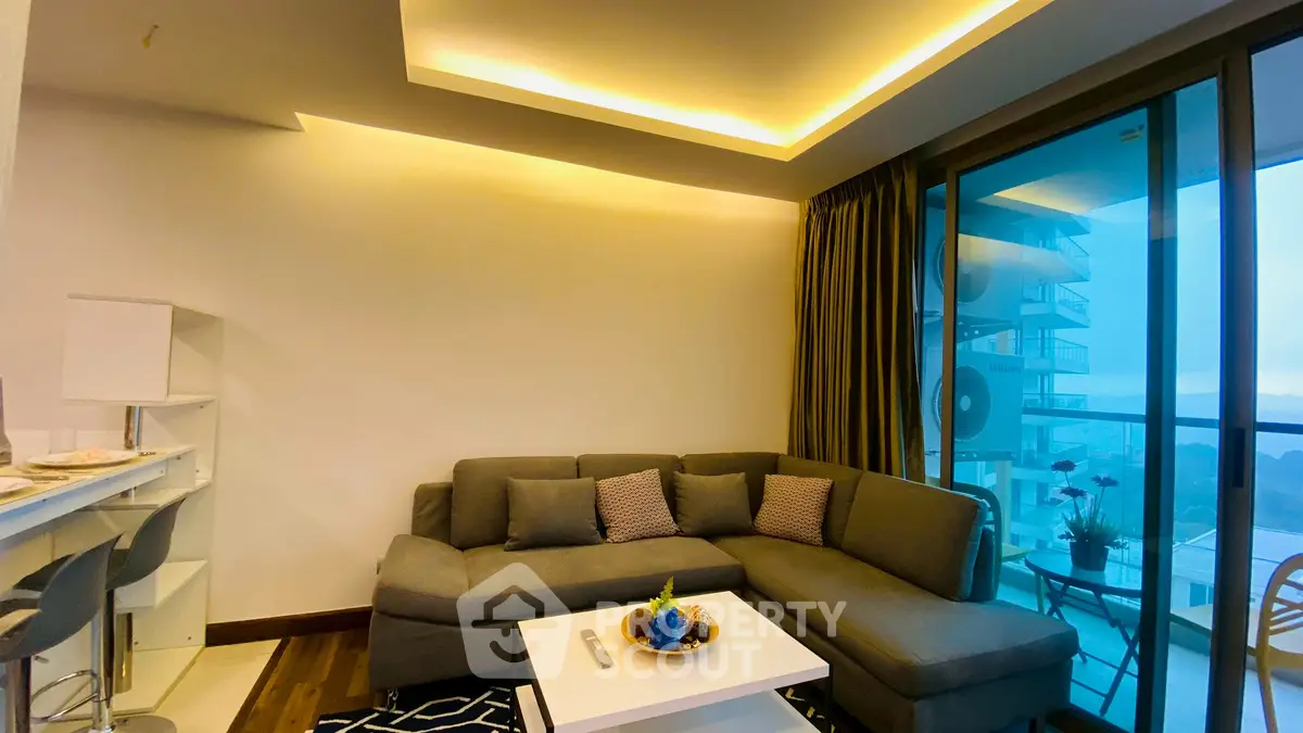 Modern living room with cozy sectional sofa and balcony view