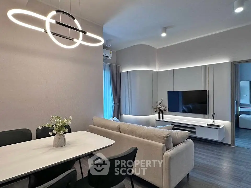 Modern living room with stylish lighting and sleek furniture, perfect for contemporary living.