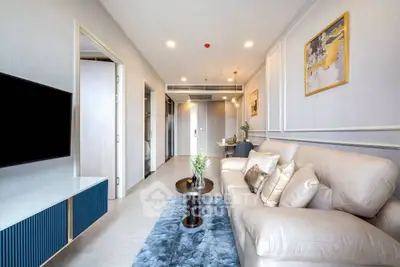 Modern living room with elegant decor and plush sofa in a stylish apartment.