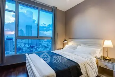 Luxurious bedroom with stunning city view and elegant decor