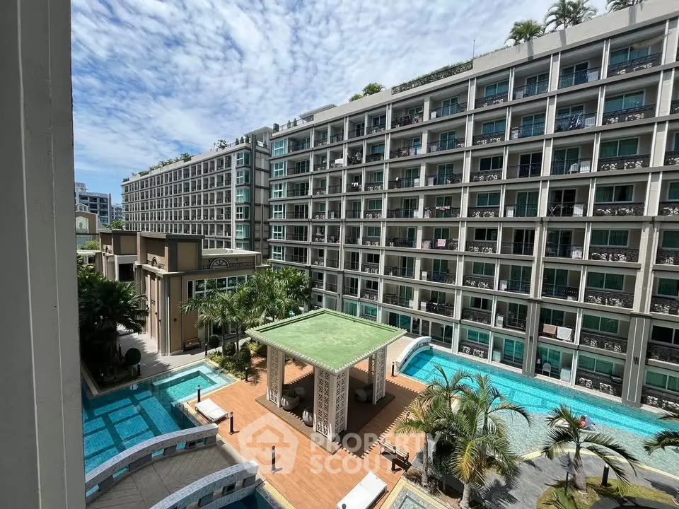 Luxurious condominium with pool and lush landscaping, offering modern living in a vibrant community.
