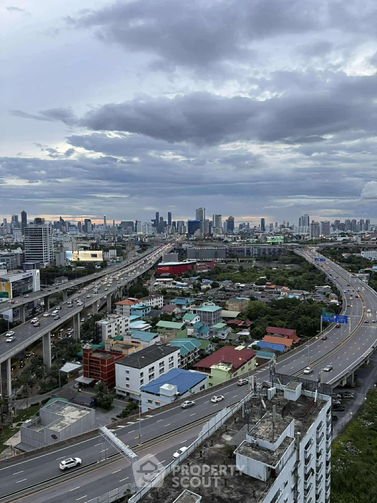Stunning cityscape view with highways and skyline, perfect for urban living enthusiasts.