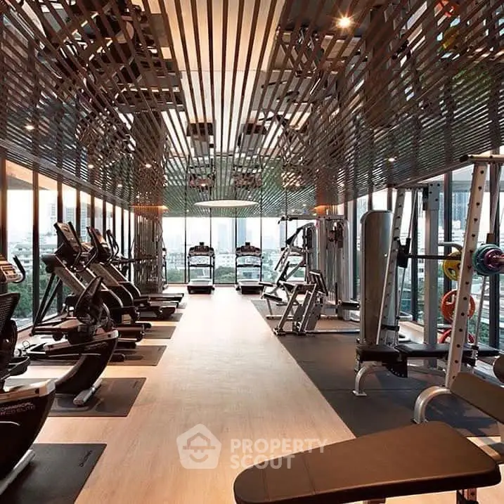 Luxurious high-rise gym with modern equipment and city views