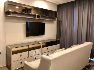 Modern living room with sleek TV setup and stylish furniture