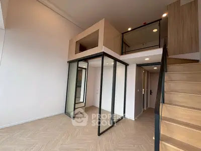 Modern duplex apartment with mezzanine and stylish wooden staircase