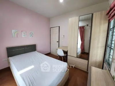 Cozy bedroom with modern furniture and natural light, perfect for relaxation and comfort.