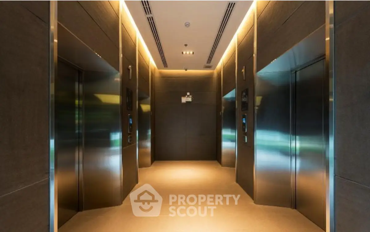 Modern elevator lobby with sleek design and ambient lighting