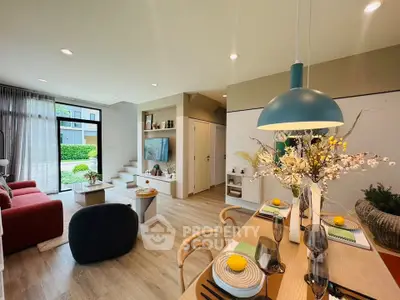 Modern open-plan living room with stylish decor and natural light