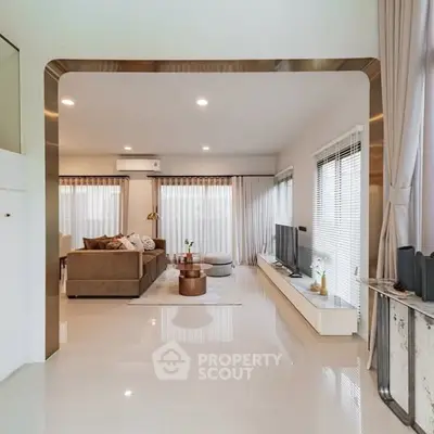 Spacious modern living room with elegant decor and ample natural light