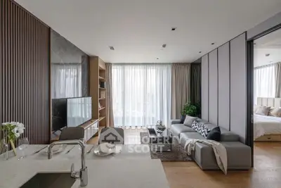 Modern open-plan living room with sleek design and natural light