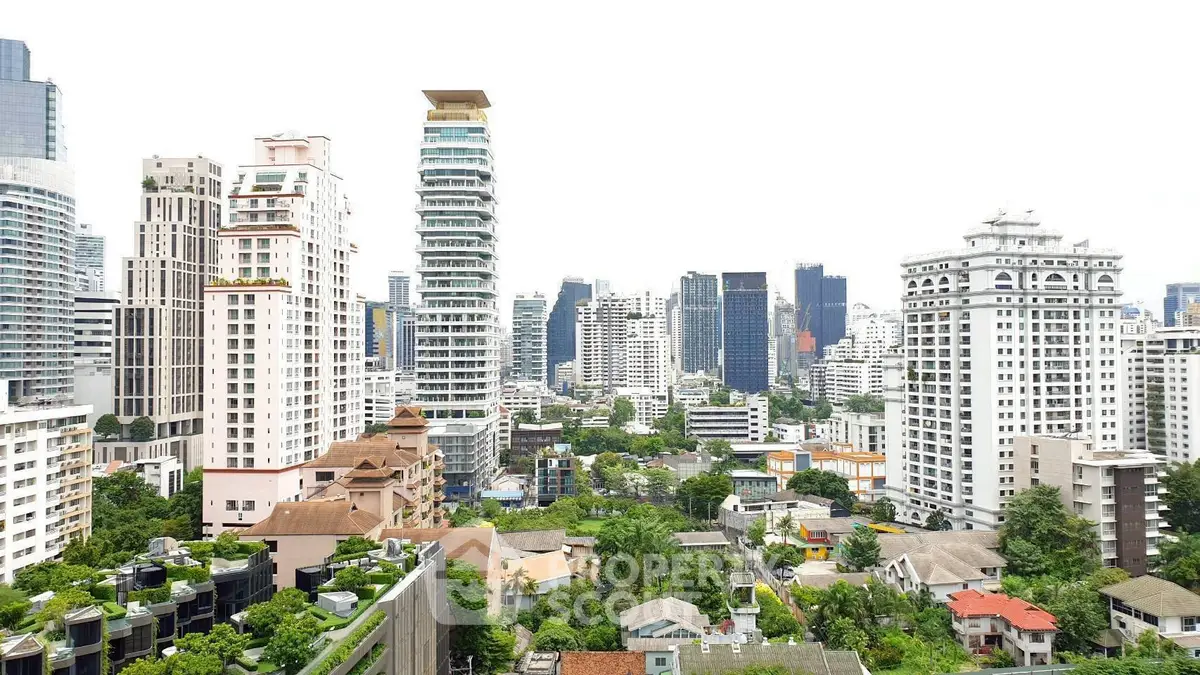 Stunning cityscape view showcasing modern high-rise buildings and lush greenery.