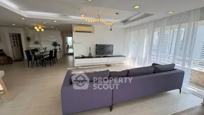 Spacious modern living room with open layout and large windows