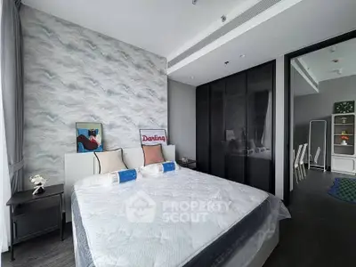 Modern bedroom with stylish decor and large bed in a contemporary apartment.