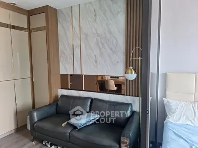 Modern living room with stylish sofa and elegant decor in a contemporary apartment.