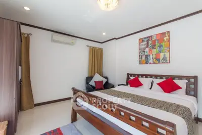 Spacious bedroom with elegant wooden bed and modern decor