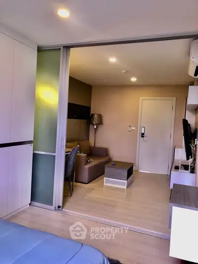 Modern living room with sliding doors and stylish furniture in a cozy apartment.