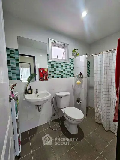 Modern bathroom with stylish tiles and functional fixtures