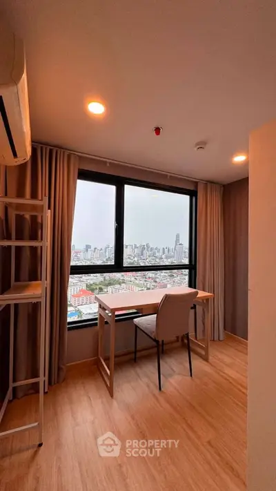 Modern study room with city view, featuring a sleek desk and chair, ideal for productivity and inspiration.