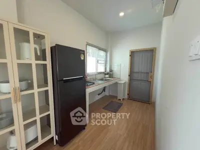 Modern kitchen with sleek appliances and ample storage space