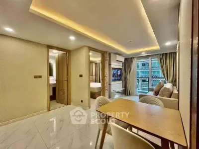 Modern open-plan living room with elegant dining area and balcony view