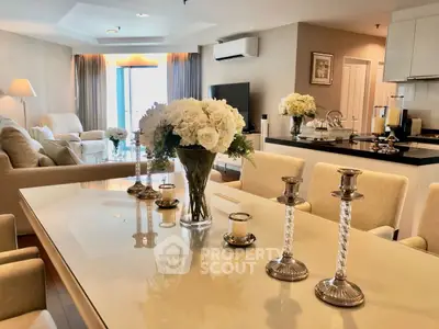 Luxurious open-plan living and dining area with elegant decor and natural light.