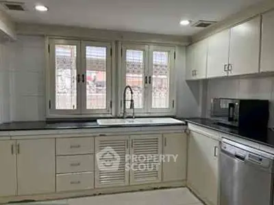 Spacious kitchen with modern appliances and ample natural light