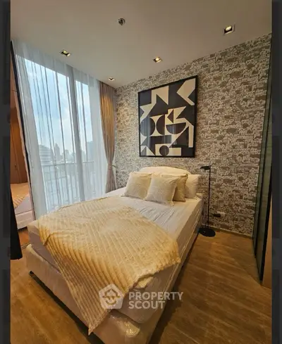 Modern bedroom with stylish decor and large window view