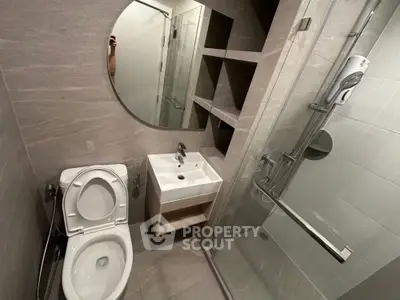Modern bathroom with sleek design and glass shower enclosure