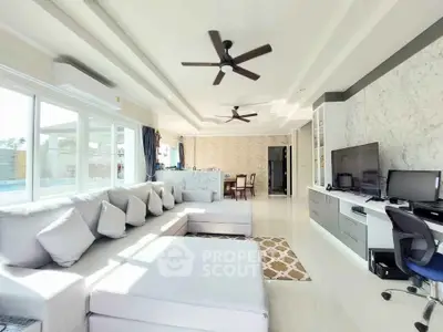 Spacious modern living room with large windows and stylish decor