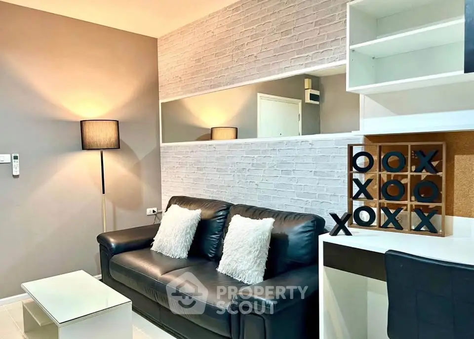 Modern living room with stylish decor and comfortable seating in a cozy apartment.