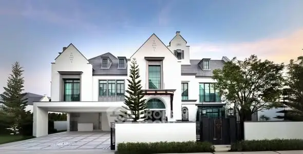 Luxurious modern mansion with elegant architecture and spacious driveway.