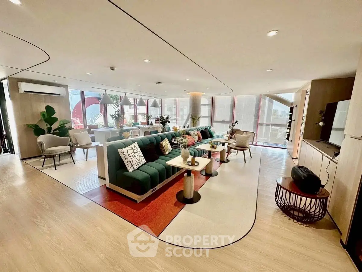 Spacious modern living room with stylish decor and abundant natural light