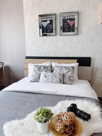 Stylish bedroom with modern decor and cozy bedding, perfect for relaxation.