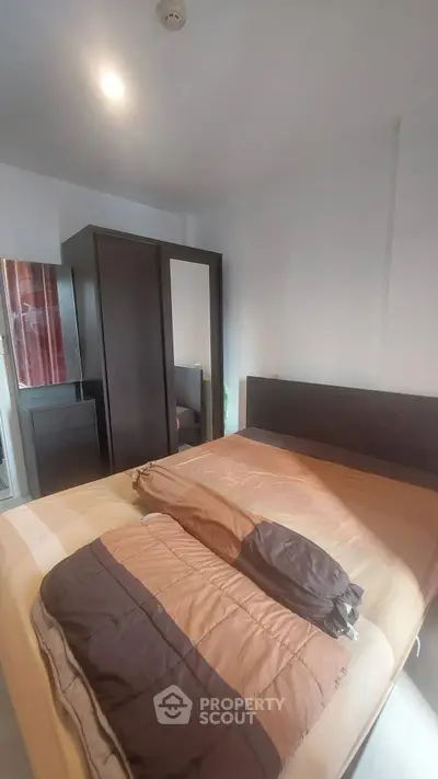 Cozy bedroom with modern furniture and ample natural light