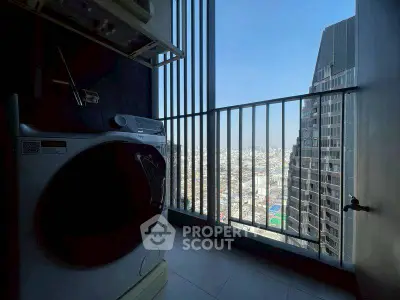 Modern apartment balcony with city view and washing machine.