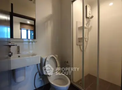 Modern bathroom with shower and sleek fixtures